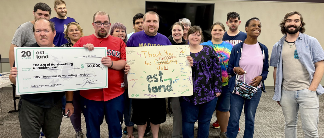 Image_20260528_142555 The Arc of Harrisonburg and Rockingham holding the Define Your Moment Check and a "Thank You Estland" poster.