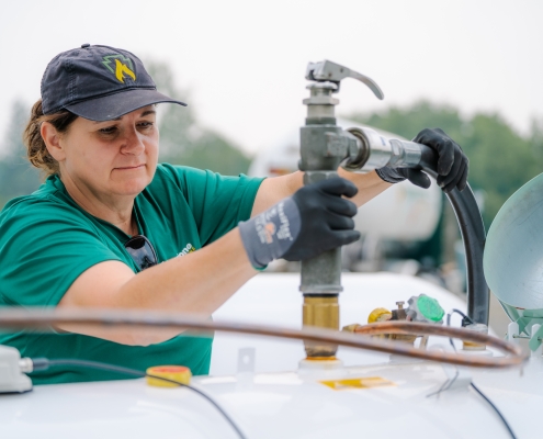 Keystone Propane technician filling a tank.