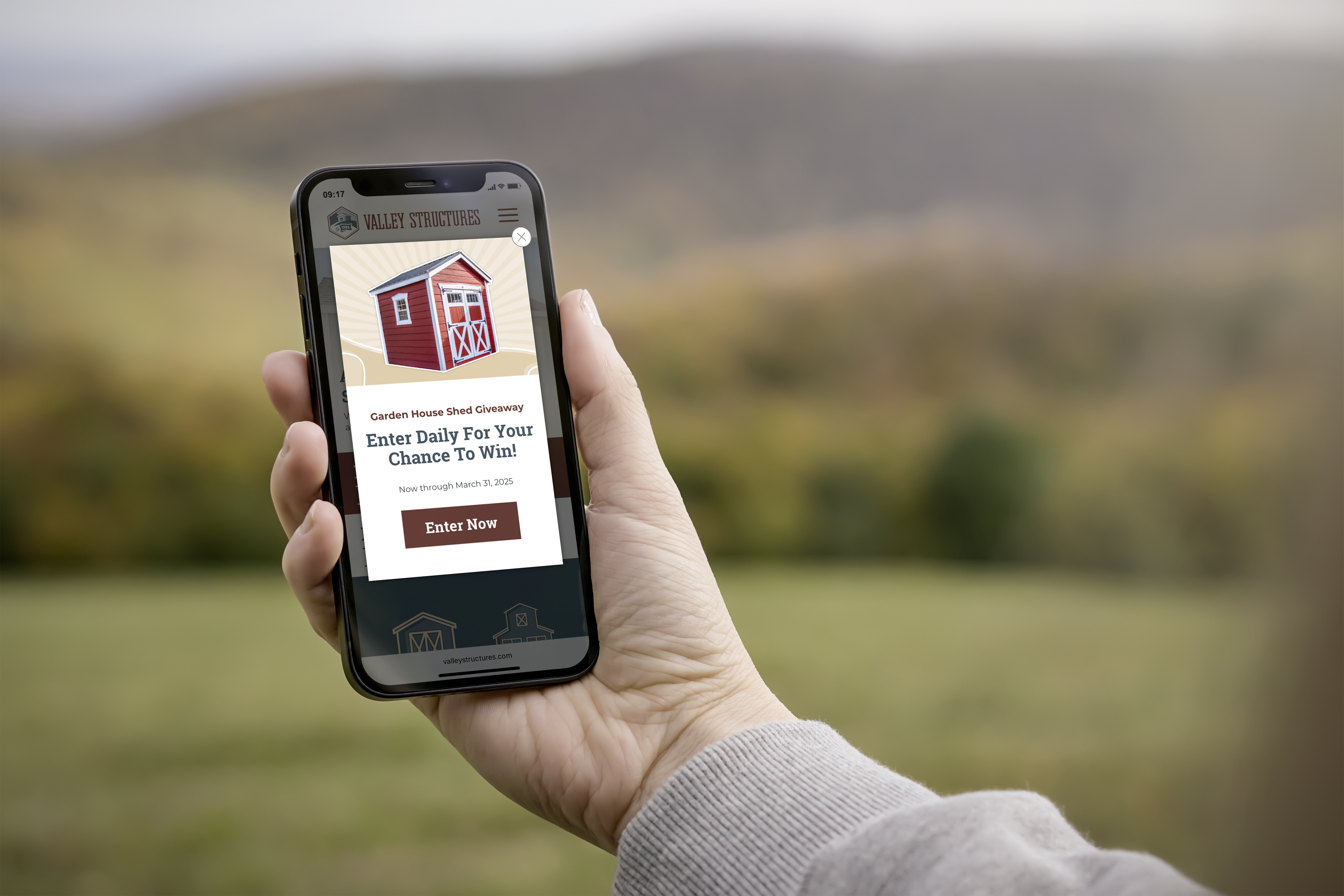 Cell phone mockup of Valley Structures website pop-up banner for shed giveaway