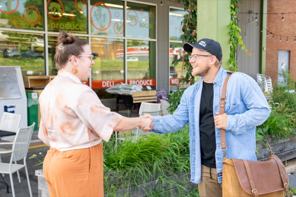 Austin Raines, one of Estland's Art Directors, meeting with a client.