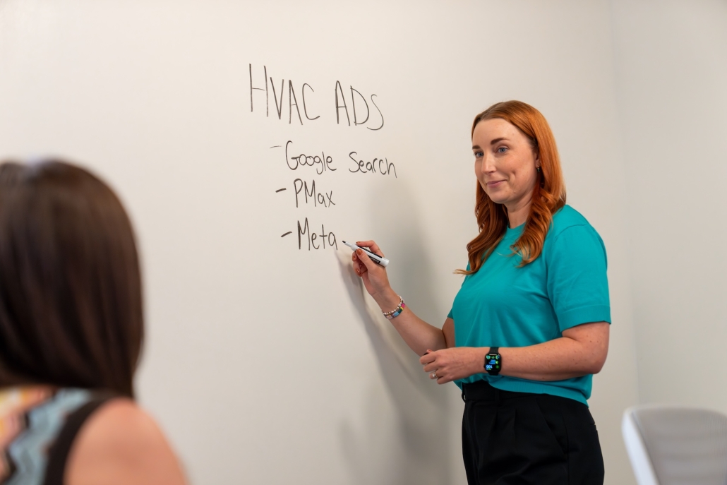 Estland teammates creating a strategy for digital ads for an HVAC campaign